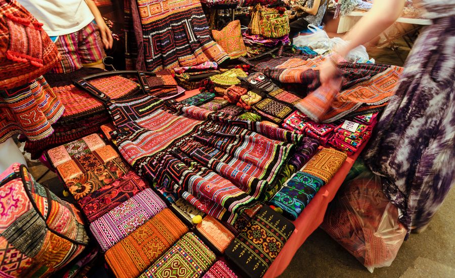 Vibrant handwoven tribal textiles and traditional handicrafts at a Chiang Mai village