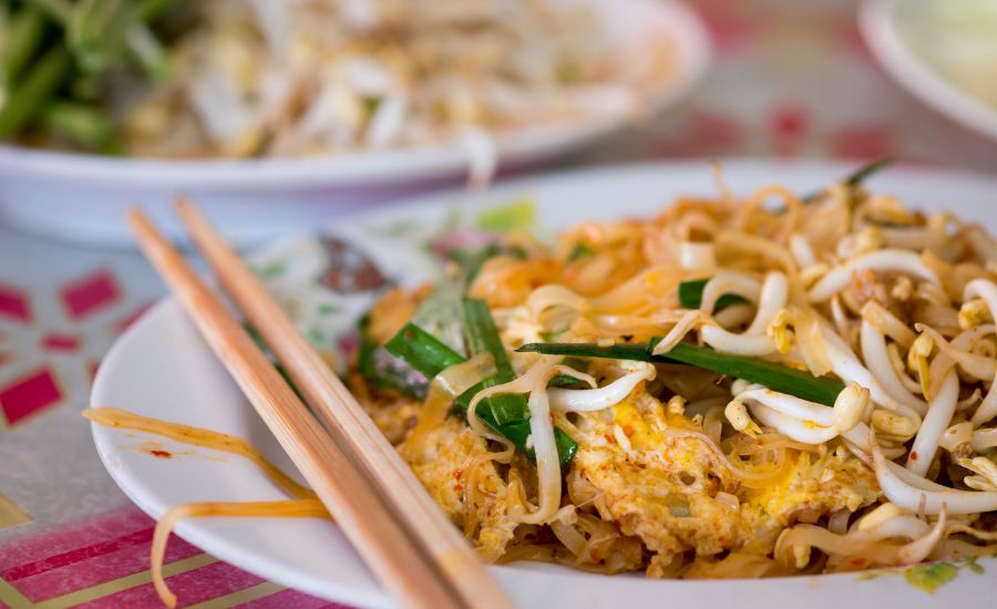 A plate of Pad Mee Korat, a traditional local stir-fried noodle dish