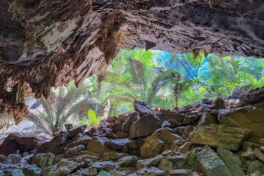 Travel through a limestone cave to discover the hidden prehistoric landscape of Hup Pa Tat.