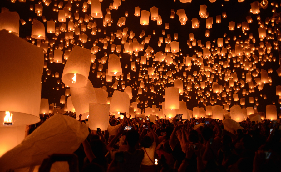 The tradition of releasing lanterns into the sky during the Yi Peng Festival