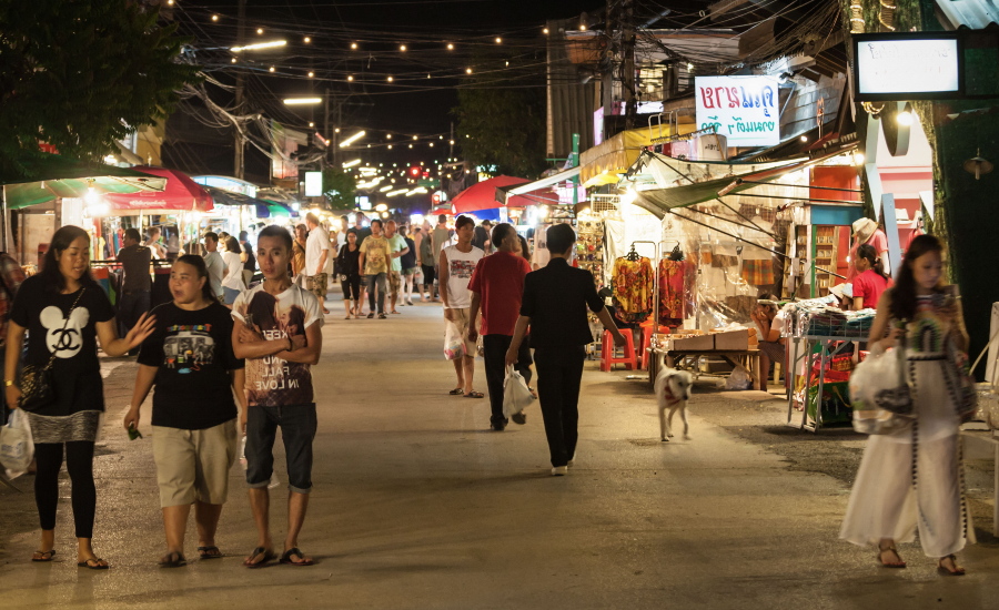 A vibrant night market scene in Thailand