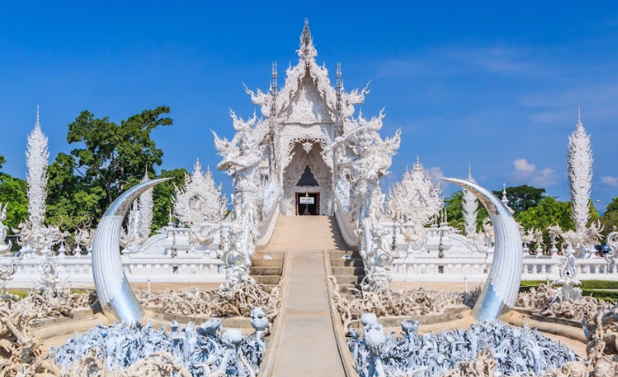 “Cycle of Rebirth” bridge with hundreds of outstretched hands beneath, whose meanings are "greed, anger, and delusion" of humanity