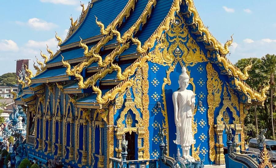 Ornate blue exterior of Wat Rong Suea Ten, Chiang Rai