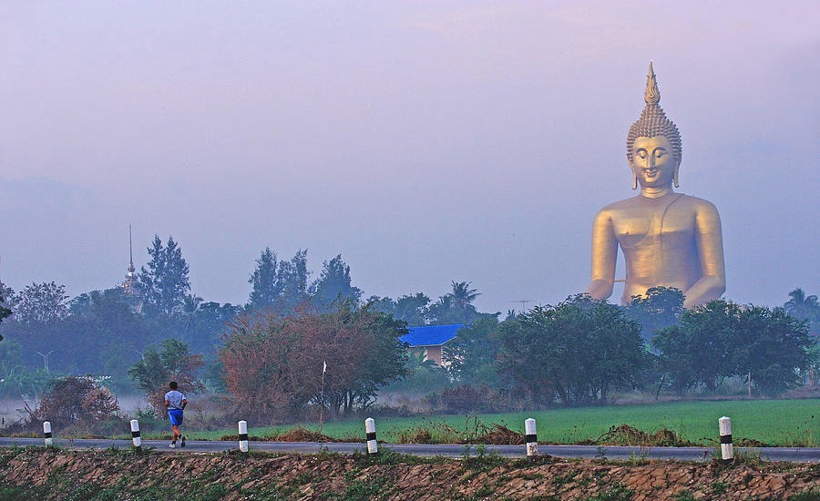 The Great Buddha rising from Wat Muang’s sky