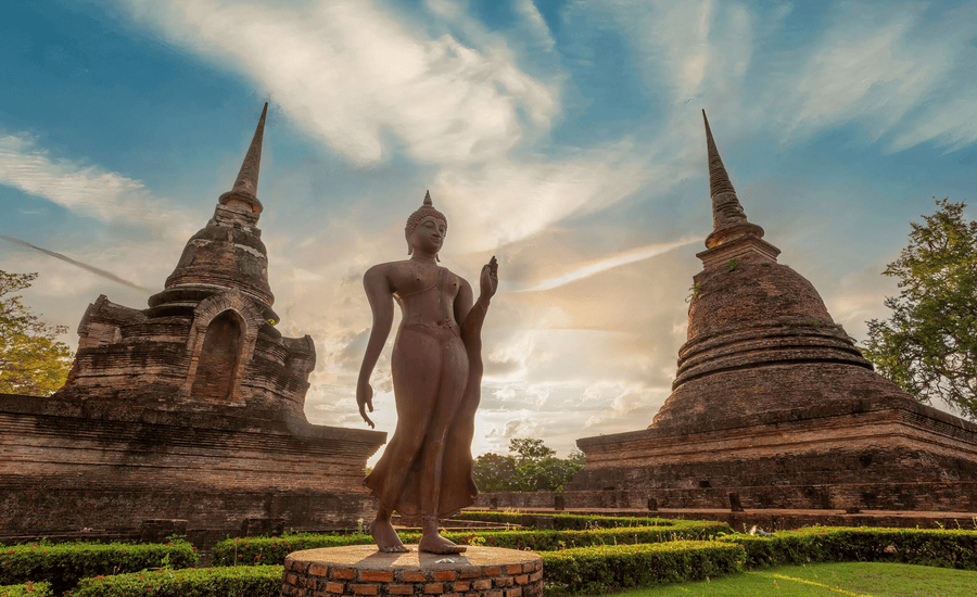 A Walking Buddha in Wat Sa Si temple, Sukhothai Historical Park