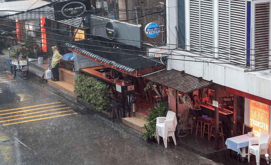 Bangkok streets washed clean by a sudden downpour, rainy season in Thailand