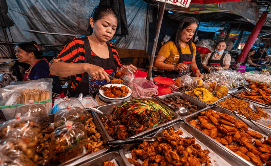 Thai street food sellers at the night market in Chiang Mai, Thailand